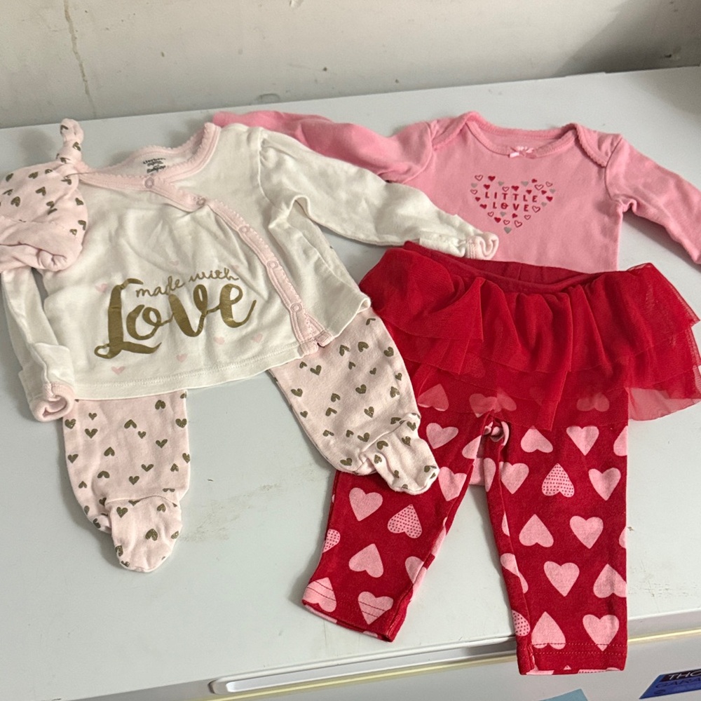 Levi's Pink Baby Onesie with Heart Design